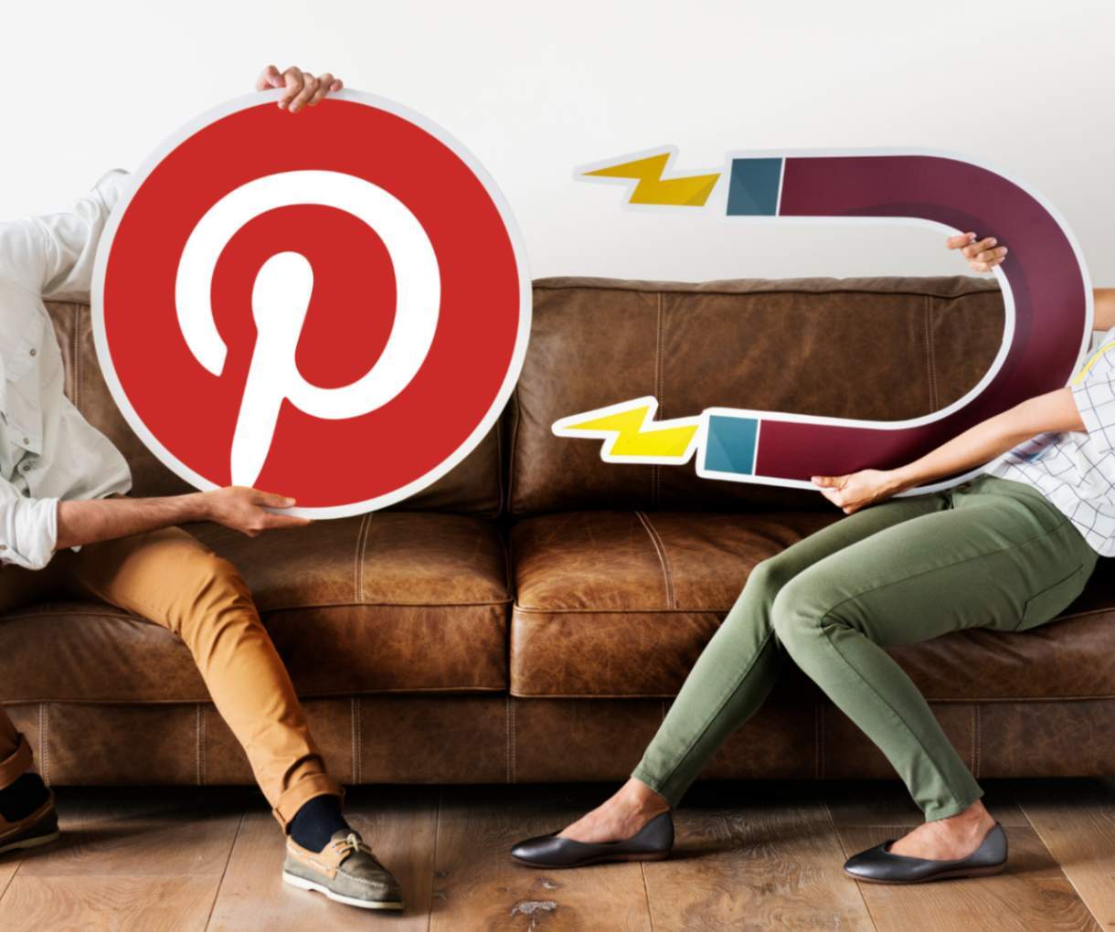People holding Pinterest logo and magnet illustration symbolizing attracting traffic and engagement through Pinterest SEO strategies.